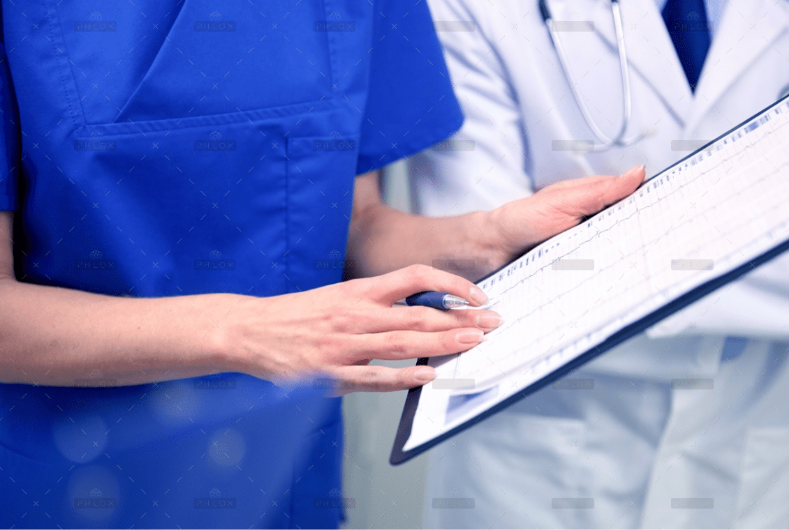 demo-attachment-1392-close-up-of-doctors-with-clipboard-at-hospital-PNAWFWS